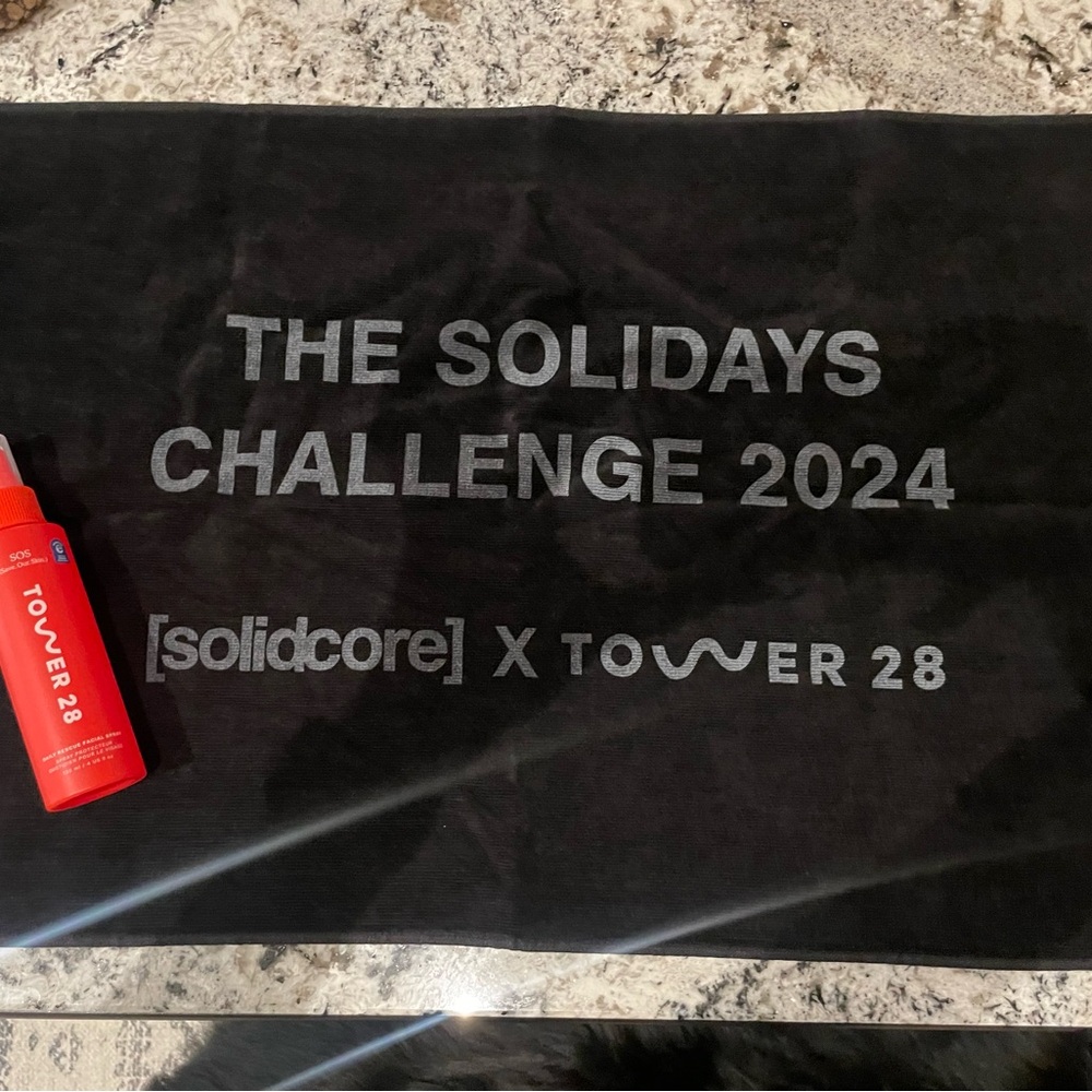 Solidcore Black Towel with Tower 28 spray